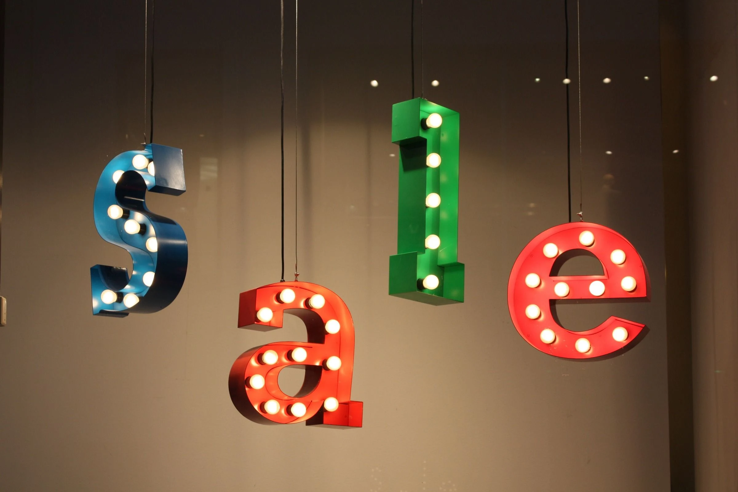 Colorful illuminated letters spelling sale