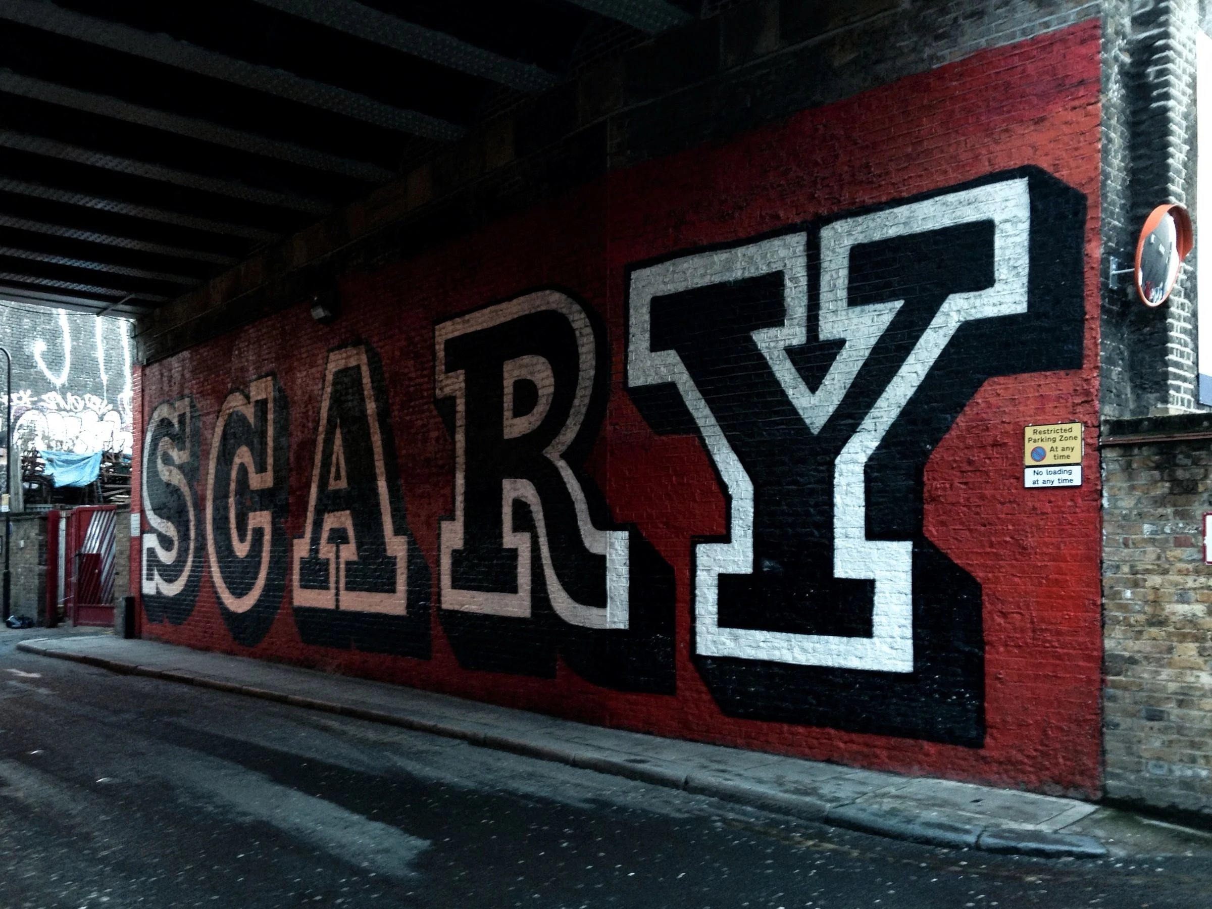 Large outlined letters on a painted surface