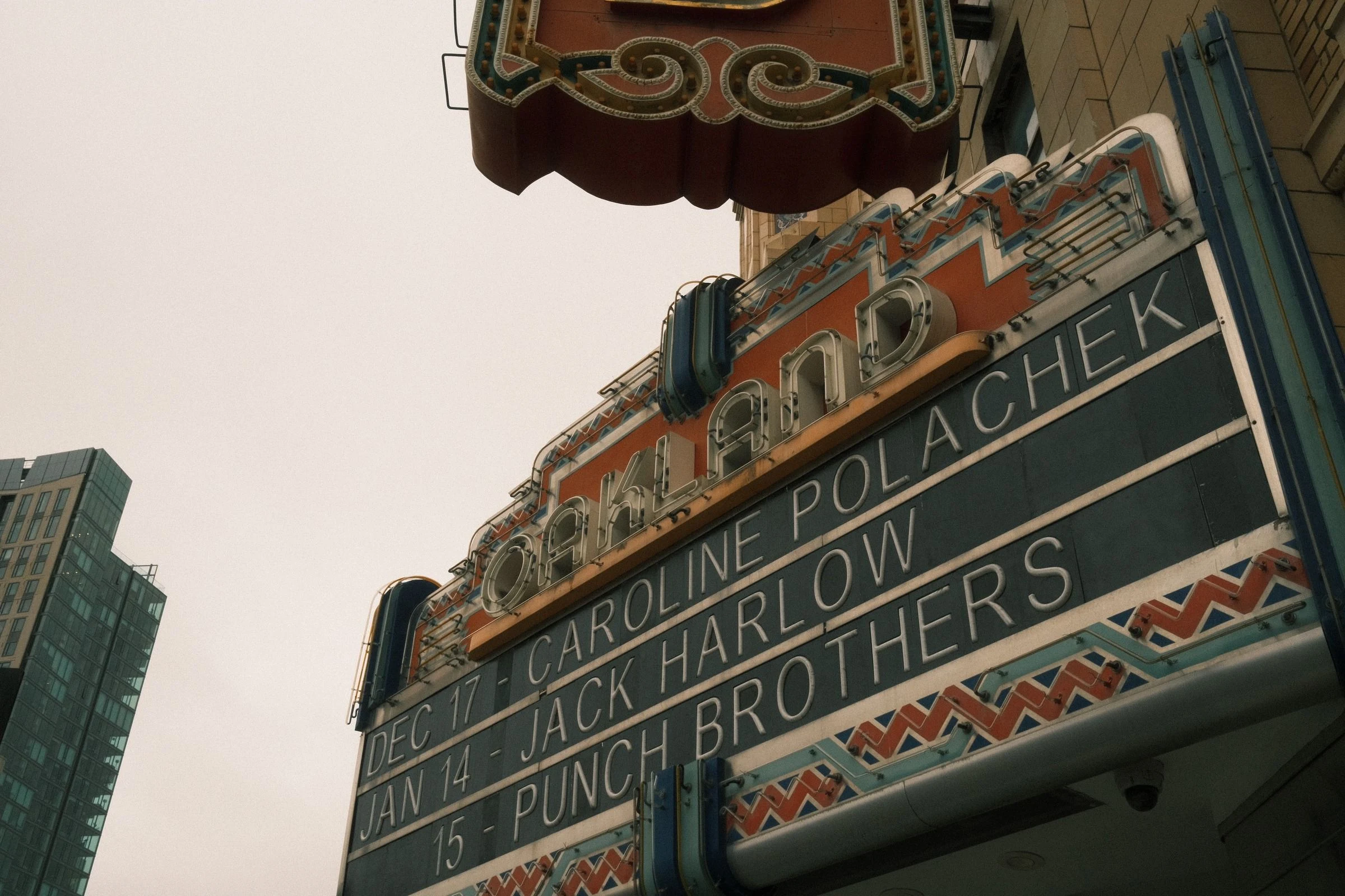 An ornate theater marquee photographed from below