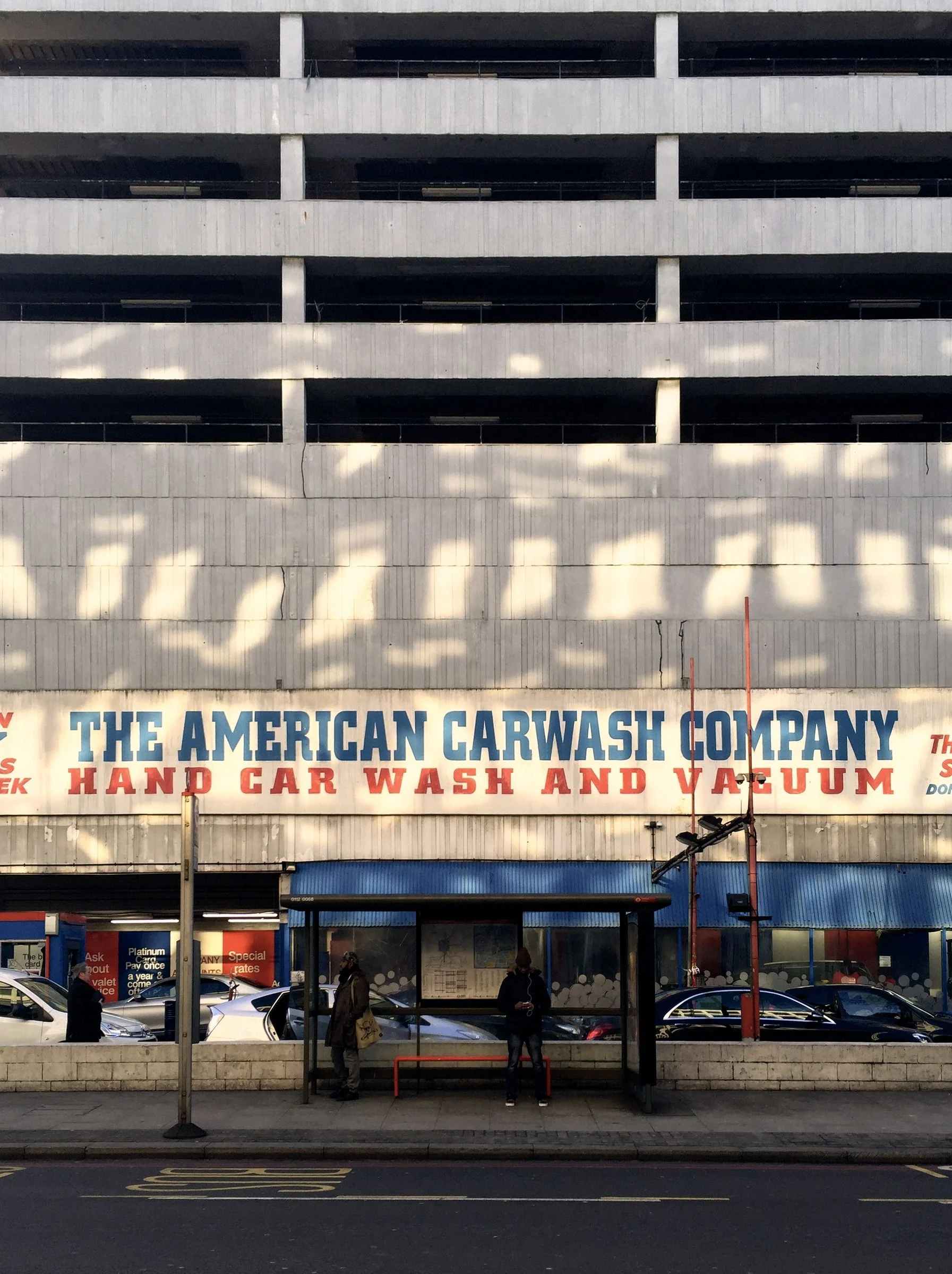 Rows of lettering across a storefront