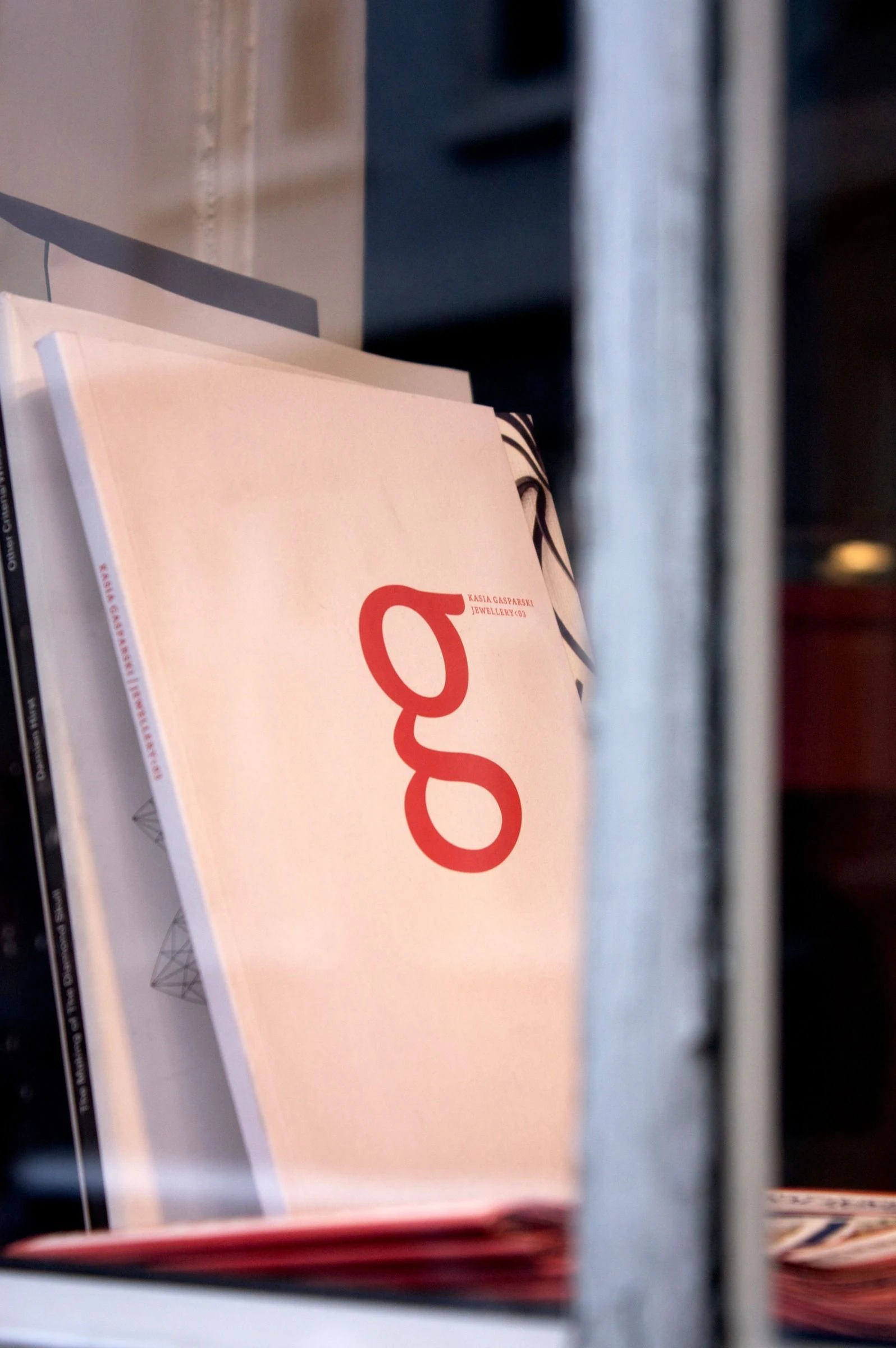 A lowercase g on a pale sign